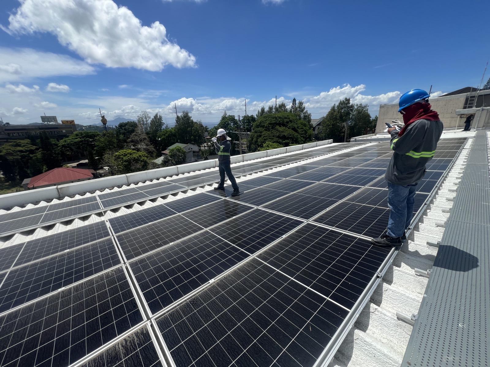 Calvert Builders engineers inspecting a rooftop solar installation